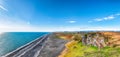 Fantasic view of Kirkjufjara black sand beach from Dyrholaey promontory on Atlantic South Coast