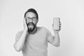 Fantastic application. Guy eyeglasses overwhelmed by new smartphone application. Man bearded happy user or developer Royalty Free Stock Photo