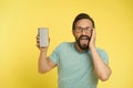 Fantastic application. Guy eyeglasses overwhelmed by new smartphone application. Man bearded happy user or developer Royalty Free Stock Photo