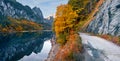 Fantastic autumn view of Gosausee Vorderer lake with Dachstein glacieron background. Royalty Free Stock Photo