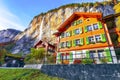 Fantastic autumn view of Lauterbrunnen village with awesome waterfall  Staubbach  in the background Royalty Free Stock Photo