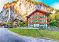 Fantastic autumn view of Lauterbrunnen village with awesome waterfall  Staubbach  in the background Royalty Free Stock Photo