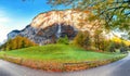 Fantastic autumn view of Lauterbrunnen village with awesome waterfall  Staubbach  in the background Royalty Free Stock Photo