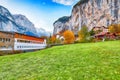 Fantastic autumn view of Lauterbrunnen village with awesome waterfall  Staubbach  and Swiss Alps in the background Royalty Free Stock Photo