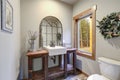 Fantastic bathroom boasts a country style wooden washstand Royalty Free Stock Photo