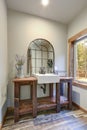 Fantastic bathroom boasts a country style wooden washstand Royalty Free Stock Photo