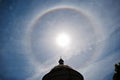 Fantastic beautiful sun halo phenomenon up the church, circular rainbow