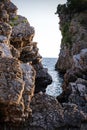 Fantastic big rocks and ocean waves at sundown time Royalty Free Stock Photo