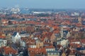 Fantastic Bruges city skyline with red tiled roofs, The Poortersloge BurgherÃ¢â¬â¢s Lodge tower and windmills in the background.