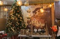 Fantastic christmas tree and other decorations at the interior of xmas shop in Terni