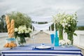 Fantastic dinner sweets near the sea on wedding day. Decoration of table. Royalty Free Stock Photo