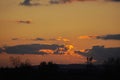 Fantastic Dramatic bright Sunny sunset over the industrial city. Silhouette of City. Selective Focus. Beautiful Natural Royalty Free Stock Photo