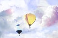Fantastic dreams. Hot air balloons in sky with fluffy clouds Royalty Free Stock Photo