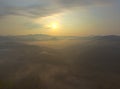 Fantastic dreamy sunrise on top of rocky mountain with view into misty valley.Mountain view.Foggy mountain.Dreamy forrest. Sunrise Royalty Free Stock Photo