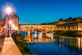 Fantastic evening cityscape of Florence with Old Palace Palazzo Vecchio or Palazzo della Signoria on background and Ponte Royalty Free Stock Photo