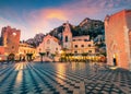 Fantastic evening view of Taormina town, IX Aprile plaza with San Giuseppe church and old fortress on background, Sicily, Italy, E Royalty Free Stock Photo