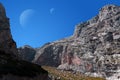 Fantastic alien landscape with rocks and two moons in the sky