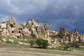 Fantastic fairy chimney rock formations with many christian cave churches at a valley near Goreme. Spring day in Cappadocia, Turke