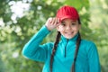 Fantastic finishing touch to your hipster outfit. Little girl wear hipster cap outdoors. Fashion accessory. Happy child