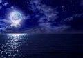 Stars, new moon over the sea at night Royalty Free Stock Photo