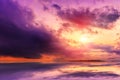 Fantastic landscape. The dramatic scene sunset over a lake, rays erupt through the heavy storm clouds reflected in the water. Royalty Free Stock Photo