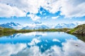 Fantastic landscape with reflection of mountains in the lake on the background of Mont Blanc, French Alps, Europe. Harmony,