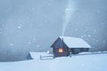 Fantastic landscape with snowy house in snowstorm Royalty Free Stock Photo