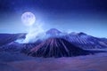 Fantastic lunar landscape in the mountains of Indonesia. Bromo volcano. Java island. Stars and moonlight