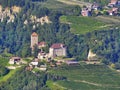 Fantastic mountain landscape. On a slope of the mountain lie at home and plantations of farms in the Southern Tyrol.