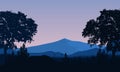 Fantastic mountain panorama with village tree silhouettes at night