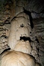 Fantastic natural speleothem looks like a face of stone god in natural cave