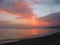 Fantastic orange blue sea ocean sunset shore cloud sky photo