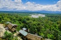 Fantastic overview of amazon jungle valley with river and waterfalls in the distance, some simple small houses located