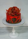 Fantastic red game of thrones cake with gilded decoration