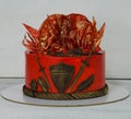 Fantastic red game of thrones cake with gilded decoration