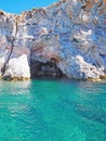 The rock cliffs of Polyaigos, an island of the Greek Cyclades Royalty Free Stock Photo