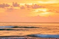 Fantastic scenic seascape at dusk, colorful sunset sky with clouds in summertime. A soft orange glow blankets the sky as gently Royalty Free Stock Photo