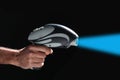 Fantastic science fiction toy laser gun isolated on black background with copy space for your text