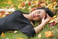 Fantastic shot of sensual woman on the leafs duvet