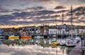 Fantastic sky over collection of boats moored in Weymouth Harbour