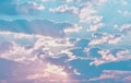 Fantastic soft white clouds against blue sky background with sun light ray.Beautiful, dramatic clouds and sky viewed from the plan Royalty Free Stock Photo