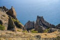 Fantastic stone pillars in the Karadag reserve, Crimea. View from the top of mountain in sanny day of golden autumn