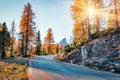 Fantastic sunny view of Dolomite Alps with yellow larch trees. Colorful autumn sunrise in mountains. Giau pass location, Italy, Eu Royalty Free Stock Photo