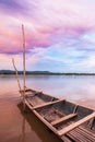 Fantastic sunset sky over the Mekong River. Colorful clouds reflecting on a water, traditional thai fishing boat foregrounds. Royalty Free Stock Photo