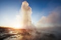 Fantastic sunset Strokkur geyser eruption in Iceland. Fantastic colors Royalty Free Stock Photo