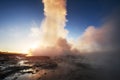 Fantastic sunset Strokkur geyser eruption in Iceland. Fantastic colors Royalty Free Stock Photo