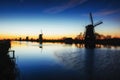 Fantastic sunset traditional Dutch windmills canal in Rotterdam.