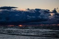 Dramatic and picturesque evening sunset scene over the sea. Storm passing, dramatic clouds after storm at sunset. Royalty Free Stock Photo