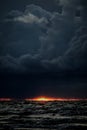 Dramatic and picturesque evening sunset scene over the sea. Storm passing, dramatic clouds after storm at sunset. Royalty Free Stock Photo