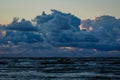 Dramatic and picturesque evening sunset scene over the sea. Storm passing, dramatic clouds after storm at sunset. Royalty Free Stock Photo